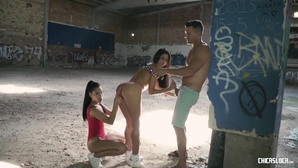 Guy having fun with two young whores in an abandoned building
